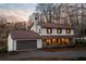 Lovely two-story house with an attached garage, a cozy front porch, and mature trees at 4568 Oswood Ct, Tucker, GA 30084