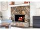Stone fireplace with a white mantle provides a cozy ambiance at 4568 Oswood Ct, Tucker, GA 30084