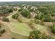 Lush golf course community featuring large custom homes and mature trees at 602 Davenport Pl, Canton, GA 30115