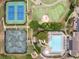 Aerial view of community tennis courts and swimming pool, showcasing the property's amenities at 602 Davenport Pl, Canton, GA 30115