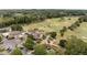 Desirable golf course community featuring a clubhouse, tennis courts, pool, and mature trees at 602 Davenport Pl, Canton, GA 30115