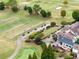Gorgeous aerial view of the golf course, golf carts and clubhouse at this exceptional community at 602 Davenport Pl, Canton, GA 30115
