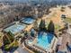 Aerial view of community amenities, including a pool, tennis court, and beautiful trees at 602 Davenport Pl, Canton, GA 30115