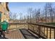 Wooden back deck with outdoor grill overlooking a tree-filled backyard at 602 Davenport Pl, Canton, GA 30115