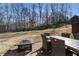 Backyard patio perfect for entertaining featuring a fire pit and outdoor dining at 602 Davenport Pl, Canton, GA 30115