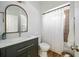 Modern bathroom with updated vanity, sink, faucet, and shower with white curtain at 602 Davenport Pl, Canton, GA 30115