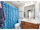 Bathroom with modern fixtures, a charming shower curtain, and stylish decor at 602 Davenport Pl, Canton, GA 30115