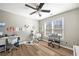 Bright, modern bedroom featuring a white desk, wood floors and a ceiling fan at 602 Davenport Pl, Canton, GA 30115