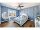 Charming blue bedroom with a hanging chair and decorative wall paneling at 602 Davenport Pl, Canton, GA 30115