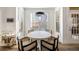 Sunny dining nook features modern light fixture and views of nature at 602 Davenport Pl, Canton, GA 30115