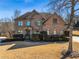 Beautiful brick home with mature landscaping, covered entrance, and meticulously maintained lawn at 602 Davenport Pl, Canton, GA 30115