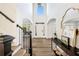 Grand foyer with high ceilings, hardwood floors, staircase, and stylish console table at 602 Davenport Pl, Canton, GA 30115