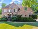 Beautiful brick home featuring manicured lawn and landscaping, perfect mix of traditional architecture and curb appeal at 602 Davenport Pl, Canton, GA 30115