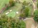 Beautiful aerial view of a golf course with well-maintained greens and manicured landscaping at 602 Davenport Pl, Canton, GA 30115