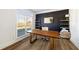 Stylish home office with a large window, modern desk, and contemporary decor providing an inspiring workspace at 602 Davenport Pl, Canton, GA 30115