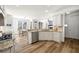 Modern kitchen featuring white cabinets, stainless steel appliances, and granite countertops at 602 Davenport Pl, Canton, GA 30115