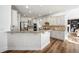 Spacious kitchen features white cabinetry, granite counters, stainless steel appliances, and wood flooring at 602 Davenport Pl, Canton, GA 30115