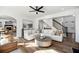 Bright and airy living room boasting hardwood floors, fireplace, and ample seating at 602 Davenport Pl, Canton, GA 30115