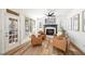 Bright living room featuring a fireplace, leather seating, and access to the outdoors at 602 Davenport Pl, Canton, GA 30115