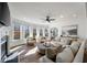 Bright living room features a fireplace, plush furniture, large windows, and natural light at 602 Davenport Pl, Canton, GA 30115