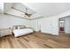 Spacious main bedroom with tray ceilings, hardwood floors, and a walk-in closet at 602 Davenport Pl, Canton, GA 30115