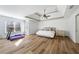 Spacious main bedroom features tray ceiling, wood floors and natural light at 602 Davenport Pl, Canton, GA 30115