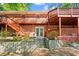 Multi-level deck and brick patio overlooking a beautifully landscaped backyard at 1618 Cooper Lake Se Rd, Smyrna, GA 30082