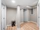 Finished basement with wood-look flooring and bright lighting at 1618 Cooper Lake Se Rd, Smyrna, GA 30082