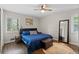 Cozy bedroom with an area rug, hardwood floors, and a bright window at 1618 Cooper Lake Se Rd, Smyrna, GA 30082