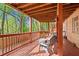 Inviting covered patio with seating, perfect for enjoying outdoor relaxation and entertainment at 1618 Cooper Lake Se Rd, Smyrna, GA 30082