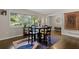 Cozy dining area with hardwood floors and natural light from a large window at 1618 Cooper Lake Se Rd, Smyrna, GA 30082