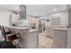The kitchen includes granite countertops, stainless steel appliances and bar seating at 1618 Cooper Lake Se Rd, Smyrna, GA 30082