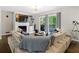 Comfortable living room with cozy seating, a brick fireplace, and access to outdoor patio at 1618 Cooper Lake Se Rd, Smyrna, GA 30082