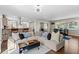 Spacious living area showcasing an open layout with hardwood floors and an eat-in bar to the kitchen at 1618 Cooper Lake Se Rd, Smyrna, GA 30082