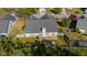 Aerial view of the backyard showing the patio and jacuzzi on a lush green lot at 1910 Charleston Oak Cir, Lawrenceville, GA 30043