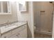 Modern bathroom featuring granite countertops and a stand-up shower with a built-in bench at 1910 Charleston Oak Cir, Lawrenceville, GA 30043