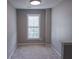 Comfortable bedroom with large windows featuring blinds for customizable light at 1910 Charleston Oak Cir, Lawrenceville, GA 30043