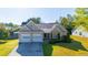 Charming single-Gathering home featuring a two-car garage and a well-manicured front lawn at 1910 Charleston Oak Cir, Lawrenceville, GA 30043