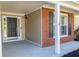 Welcoming front porch with a black door, brick accents, and white pillars for a stylish entrance at 1910 Charleston Oak Cir, Lawrenceville, GA 30043