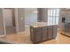 Spacious kitchen with granite island, stainless steel appliances, and modern lighting at 1910 Charleston Oak Cir, Lawrenceville, GA 30043