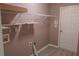 Laundry room equipped with shelving and a utility sink hookup at 1910 Charleston Oak Cir, Lawrenceville, GA 30043