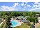 Community featuring a pool, tennis courts, and well-maintained common areas from an aerial perspective at 404 Prague Way, Hampton, GA 30228