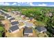 Expansive aerial view of a new construction neighborhood with beautiful homes and green spaces at 404 Prague Way, Hampton, GA 30228