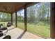 Screened-in porch overlooks the home's spacious lawn at 404 Prague Way, Hampton, GA 30228