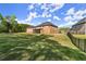 Sprawling backyard featuring lush lawn and potential for outdoor activities at 404 Prague Way, Hampton, GA 30228