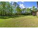 Expansive green backyard, perfect for recreation or relaxing in nature at 404 Prague Way, Hampton, GA 30228