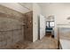 Modern bathroom with a tiled walk-in shower and a clear view of the adjacent bedroom at 404 Prague Way, Hampton, GA 30228