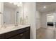 Bright bathroom featuring a vanity with dark wood cabinets, ample counter space, and tile floors at 404 Prague Way, Hampton, GA 30228
