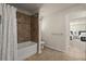 Bathroom features a combined shower and tub with tile surround and plenty of storage at 404 Prague Way, Hampton, GA 30228