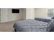 Spacious bedroom features neutral walls, plush carpet, and two comfortable beds for guests and Gathering at 404 Prague Way, Hampton, GA 30228